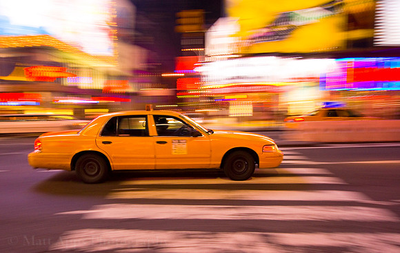 Taxi cab speeding through New York City, with motion blur